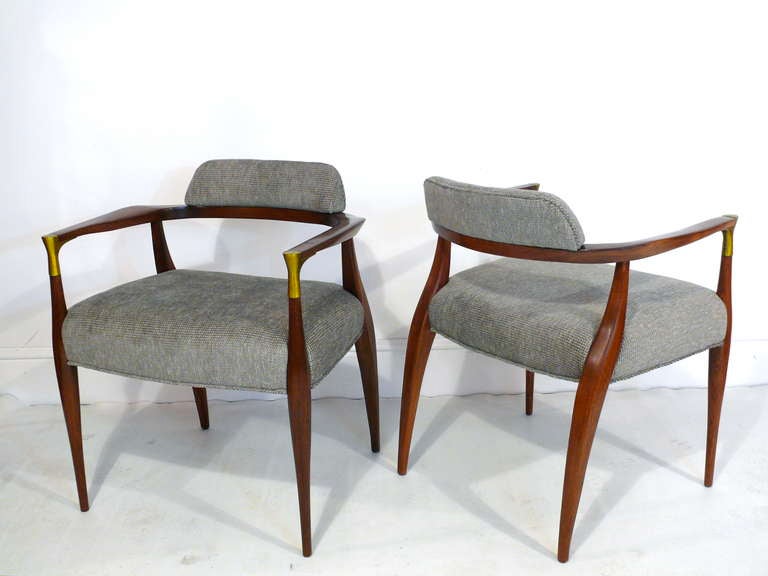 Set of four chairs attributed to Bert England.  Sculpted of walnut with brass arm accents and back rest covered in chenille.  

Please visit Fairfield County's largest freestanding destination for Mid-Century Modern furniture, lighting, decorative