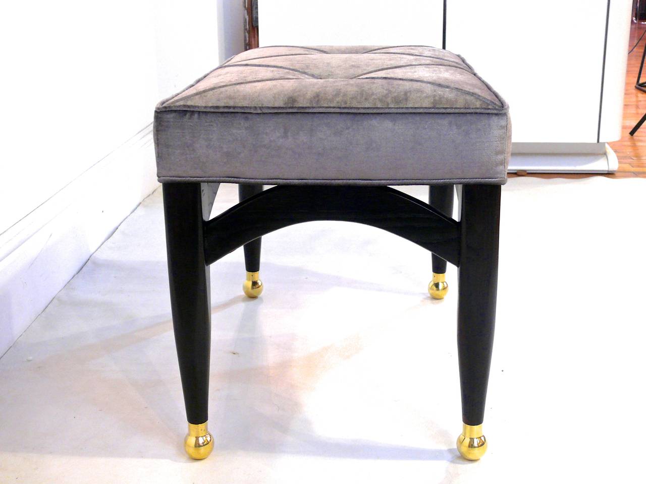 Brass Pair of Sculptural Ebonized Ottomans