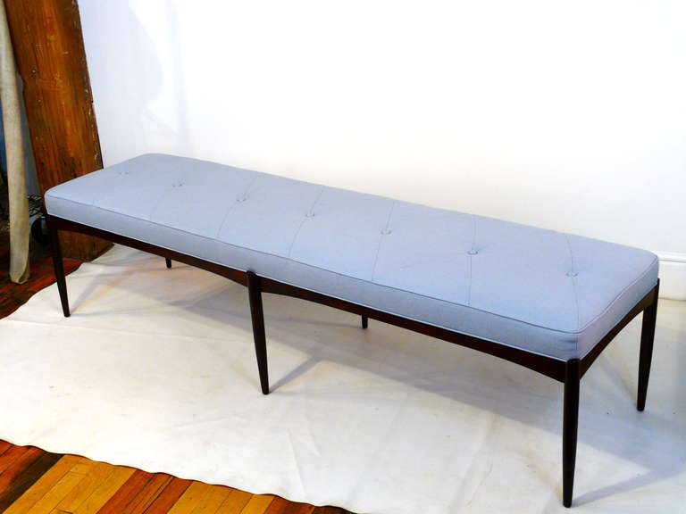 Mid Century Modern bench with a gorgeous seamed tufted top and a 6 legged espresso finished base.