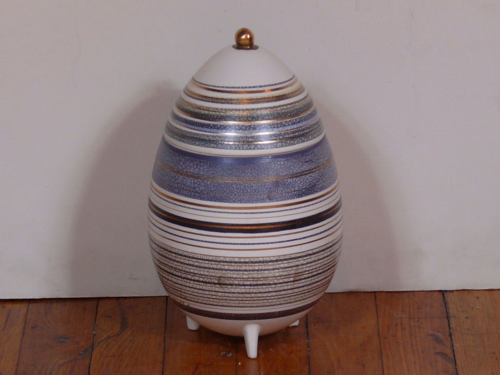 Beautiful oversized egg by renowned ceramist Sascha Brastoff.  Striped of crackled blue, gold and black.  Mint vintage condition