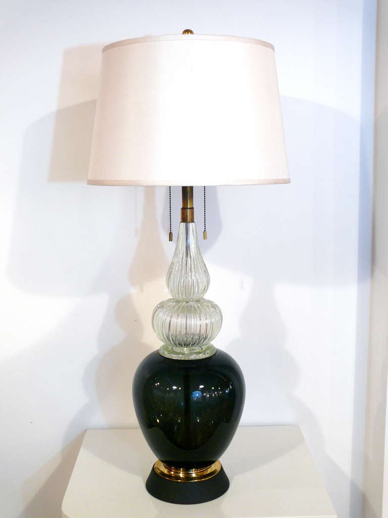 A single Venini lamp of monumental proportion made of handblown black glass with fluted gourd design. We are attributing this lamp to Barovier is shade not included.

 
