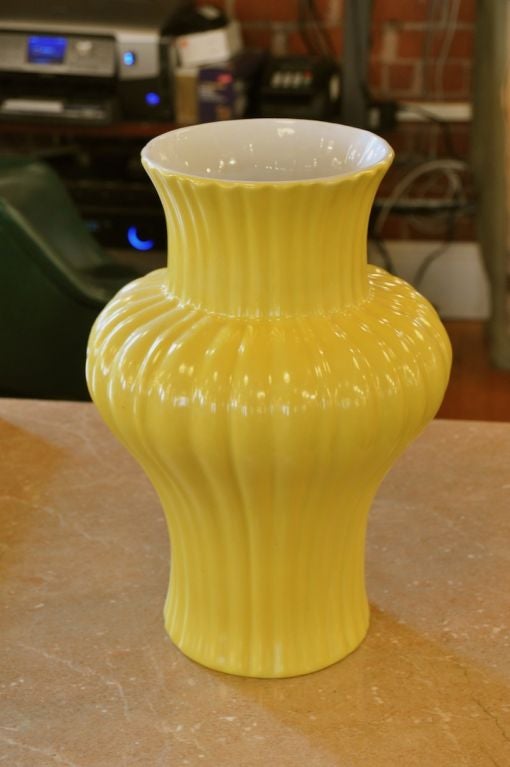 Get a burst of sunshine from the vivid yellow of this Mid Century fluted glazed ceramic vase.  The vase has graceful, sinewy lines and is poised to hold any arrangement or stand on its own.  Interior is glazed in white.

Please visit Fairfield