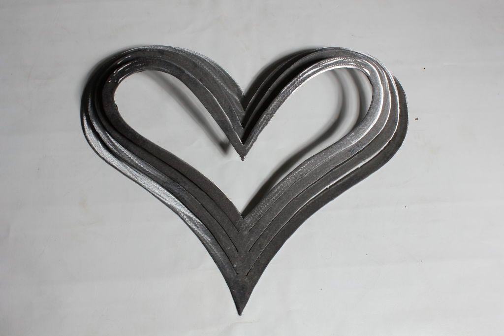 Set of 3 dimensional steel heart shaped wall sculptures.<br />
<br />
