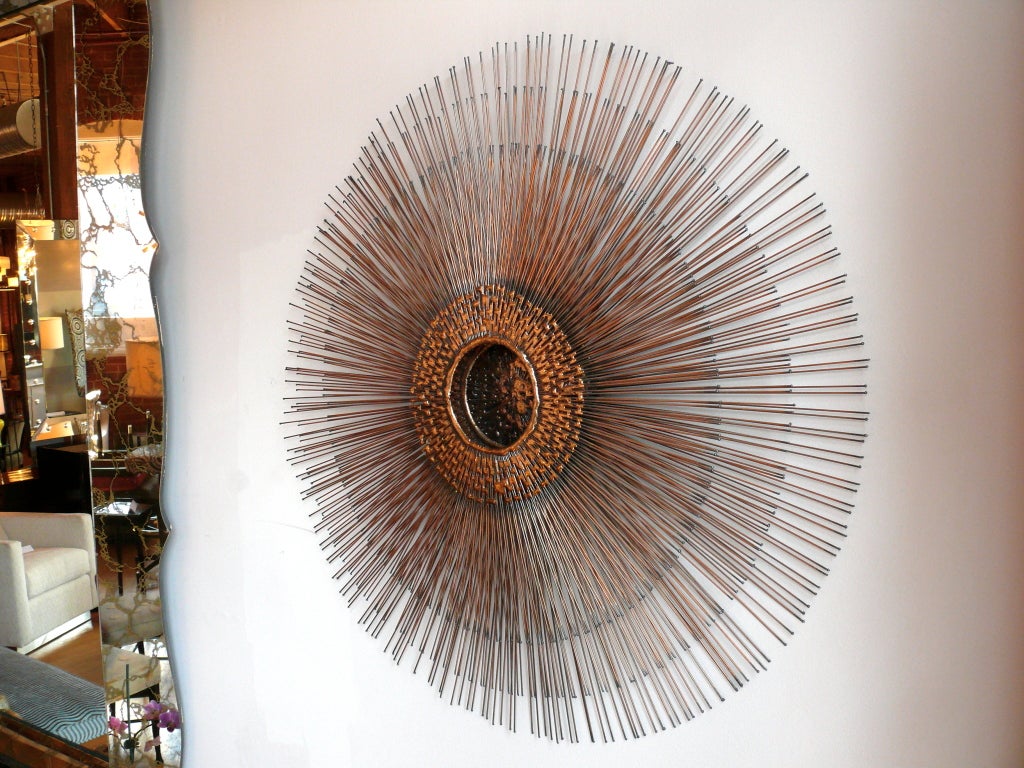 Wonderful Mid Century 3 layer Sunburst metal sculpture with molten centerin the manner of Bertoia and Curtis Jere.  Hues of brass copper and black are all visible through the layers.<br />
<br />
