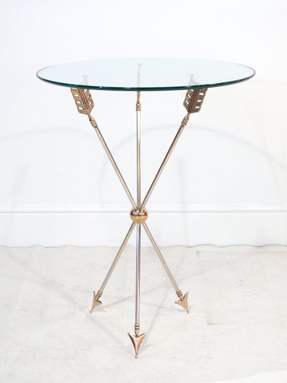 FINAL SALE!  No holds on this item.  Sale ends Friday, 2/15.Beautiful side table with brass and chrome arrow shaped legs and a round glass top.

Please visit Fairfield County's largest freestanding destination for Mid-Century Modern furniture,