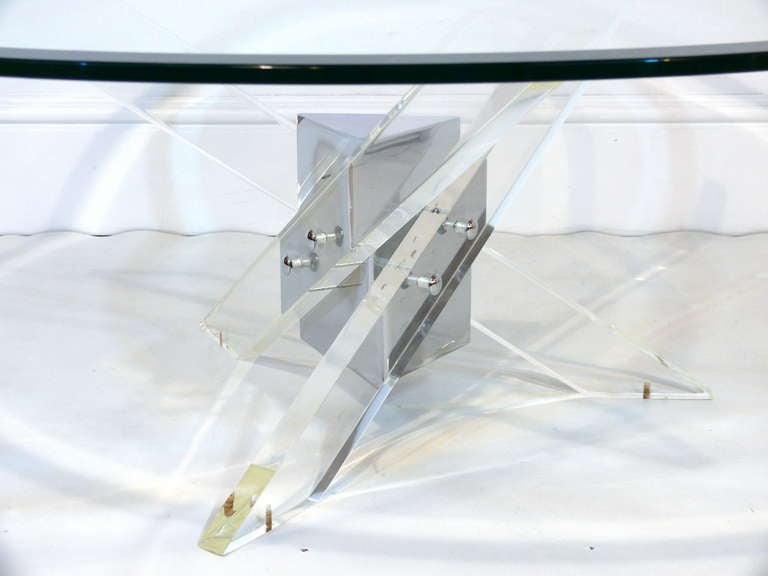 Stunning lucite and chrome coffee table with glass top.  Newly polished lucite is gleaming against the chrome and held together with chrome fasteners.  Pictured with a 42