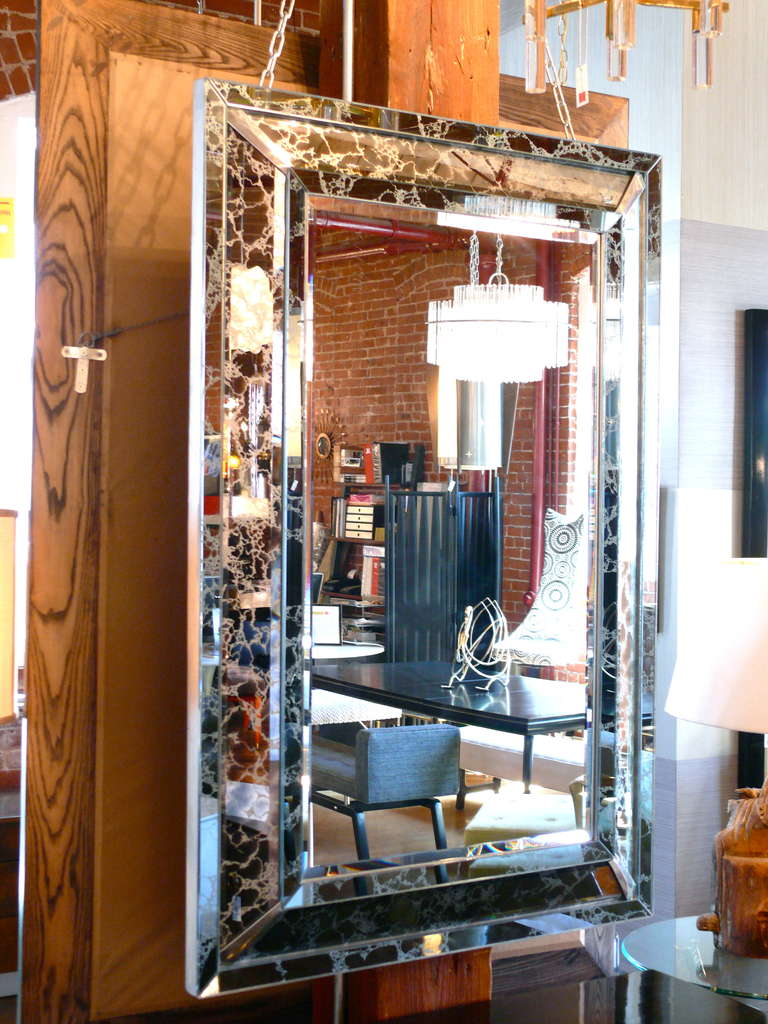 A unique pair of silver veined beveled mirrors with chrome corners.

Please visit Fairfield County's largest freestanding destination for Mid-Century Modern furniture, lighting, decorative art and fine art at 583 Pacific Street, Stamford Ct. View