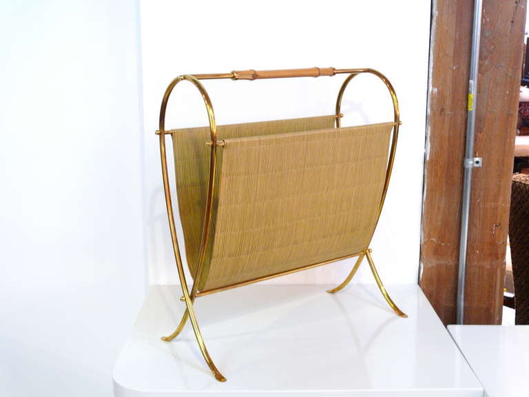 Italian magazine rack from the 50's in incredible condition. The bamboo reminiscent of a Gucci handbag. Very chic and unusual piece.