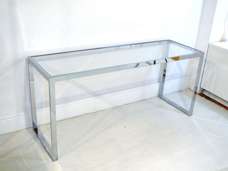 Sleek chrome framed console by Milo Baughman.  Glass top in great vintage condition.  Very minor scratches due to age and use.
