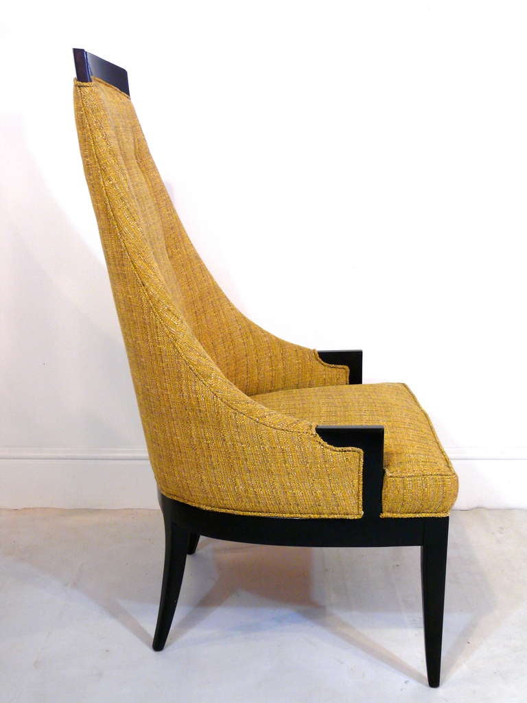 Pair of sculptural high back chairs with exposed wood trim.  Refinished in dark espresso and reupholstered in a golden yellow Brunschweig fabric.