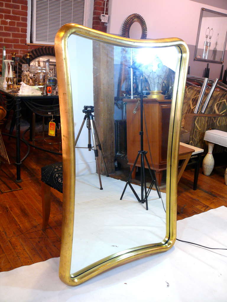 Biomorphic gold leaf mirror.

Please visit Fairfield County's largest freestanding destination for Mid-Century Modern furniture, lighting, decorative art and fine art at 583 Pacific Street, Stamford Ct. View our entire collection at