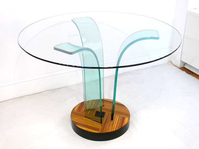 Spectacular glass top center table by New Era featuring three robust curved glass pieces resting on a refinished zebrawood base. Glass top measures 42" in diameter. Other sizes of glass tops are available.