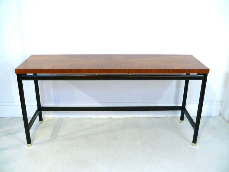 Beautiful console table with inlaid diamond patterned top in walnut. The base is ebonized with brass sabots and risers.