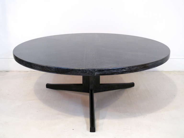 Danish coffee table in the style of Kofod-Larsen with solid wood tripod base and a round inlaid top. Newly finished in cerused black.