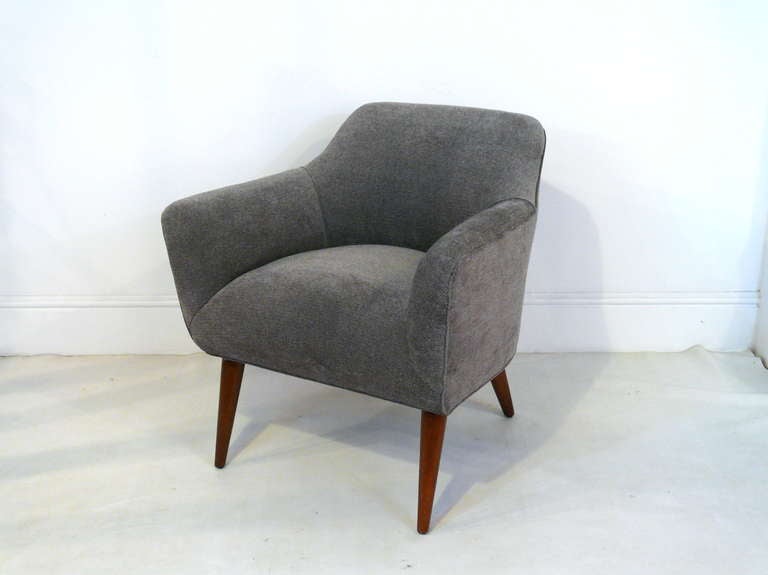 Pair of upholstered chairs in the manner of Saarinen with newly finished walnut legs and chenille upholstery.  Stunning profile.