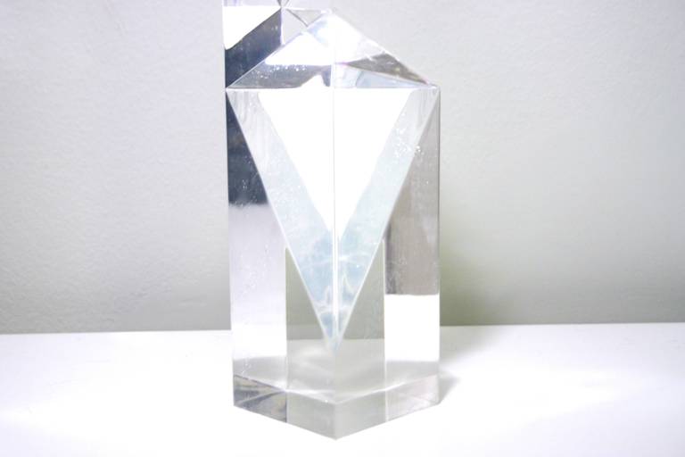 Oversized multi-faceted Lucite sculpture by Italian designer Alessio Tasca . Its gleaming sharp geometrical lines and prismatic shape offers a different visual on a variety of angles. A perfect addition to any decor.

Alessio Tasca was born in