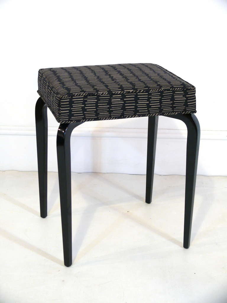 Stunning pair of lacquered bentwood stools with upholstered tops. Legs finished in a gloss black with black and dash upholstery. COM available,