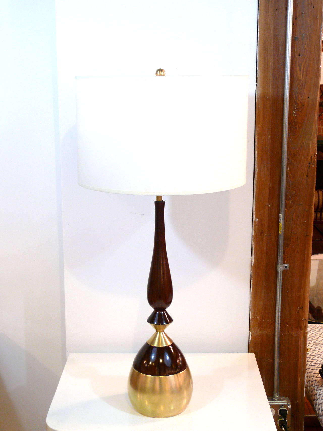 Fabulous pair of Mid-Century sculptural myrtle wood shaped lamps with substantial brass base and accents, refinished to perfection in a rich high gloss medium walnut with beautiful visible grain. Either made by Modeline or Westwood and in the manner