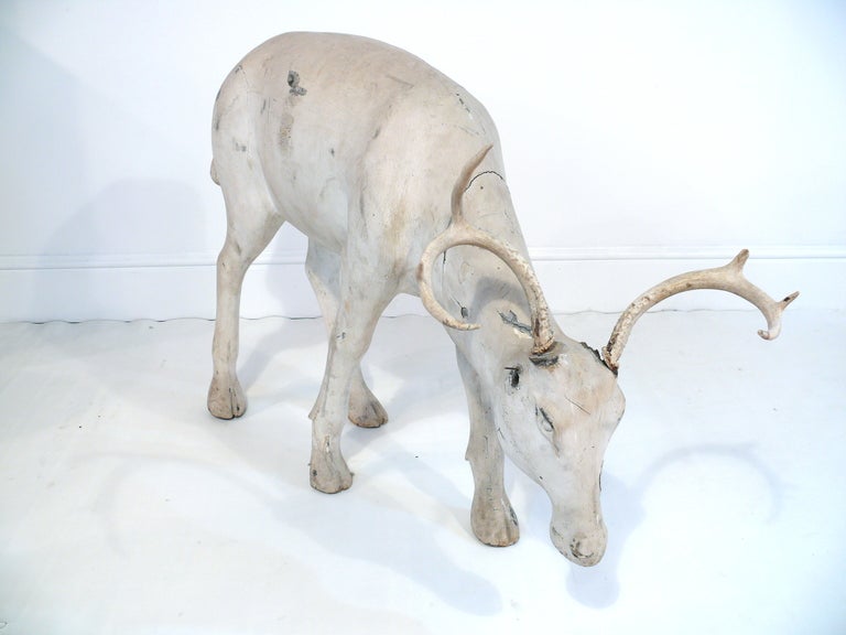 Hand made wooden deer/reindeer in a poetic pose.  Horns are real horn and are detachable.  A really unique piece of folk art.<br />
<br />
