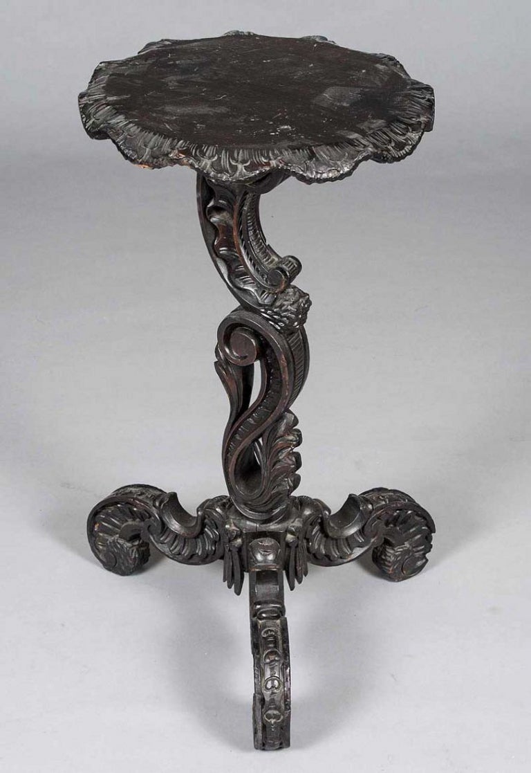 The blackened Walnut frame carved in exuberant Rococo revival style. 