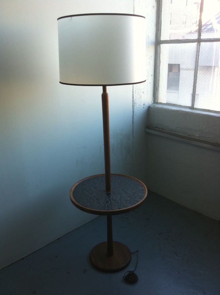 A fine table lamp by Gordon & Jane Martz for Marshall Studios with black circular tile top (a trademark of the Martz duo's work for Marshall Studios) with a beautiful walnut column and base.