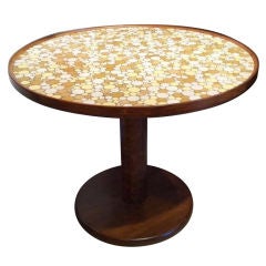 A Large Circular Dining Table with a Tile top by Martz