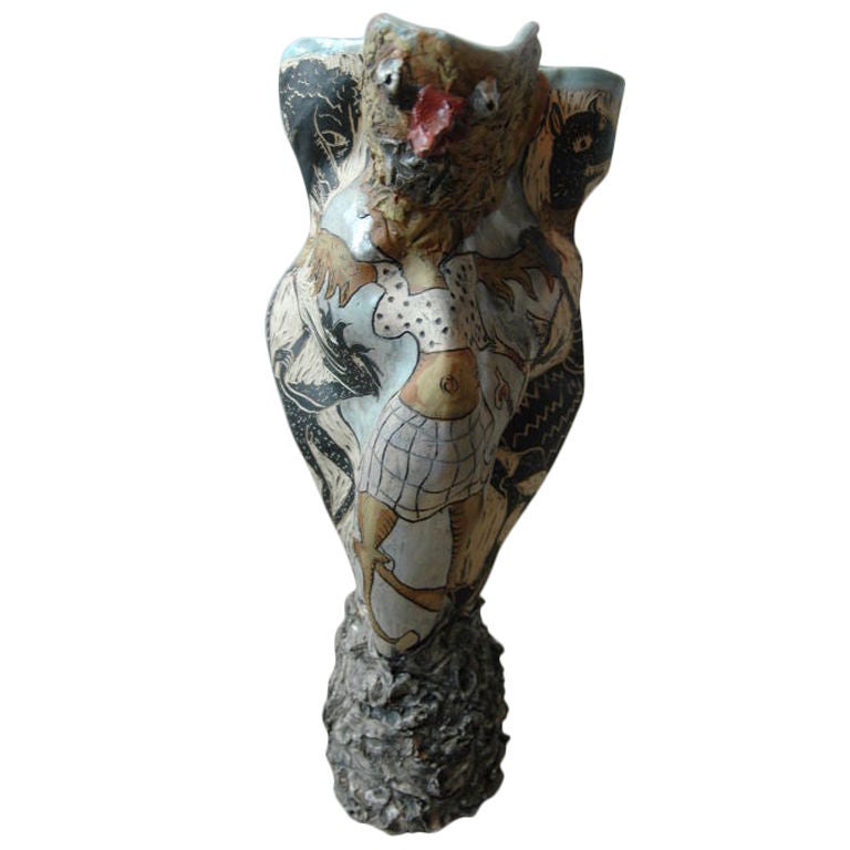 A surreal vase that has a different look from each side and is reminiscent of Picasso ceramics.