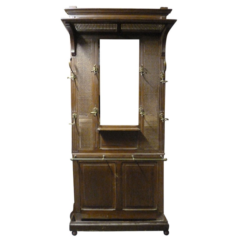 An English Caned and Walnut Mirror Halltree with umbrella stand