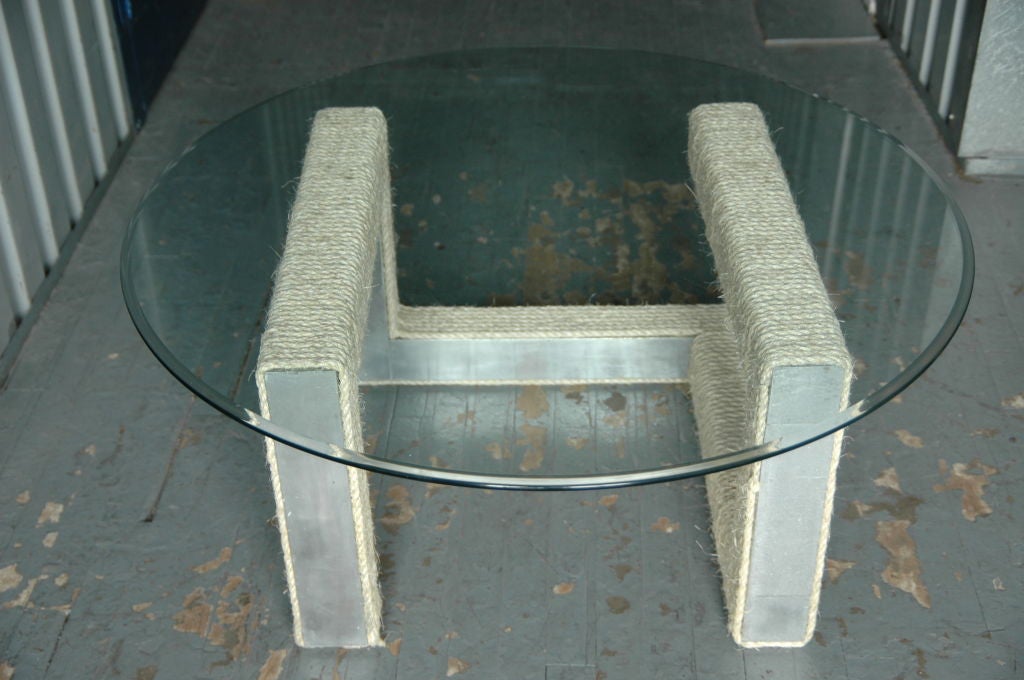 A metal zig-zag structure wrapped in rope suitable as a coffee table or if flipped as a dining table base