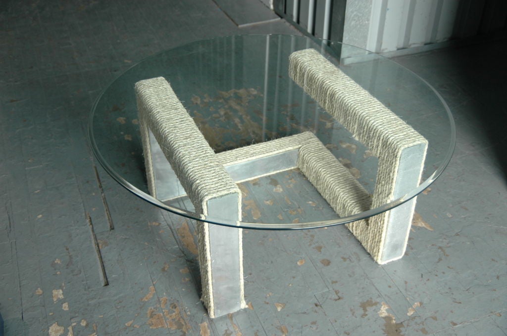 An unusual rope wrapped metal table base and glass top 1