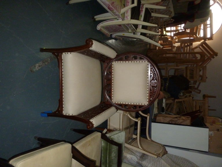 Fine, unusual circular-back armchair in the manner of Herter Brothers or one of their New York contemporaries. The carved mahogany frame with carved decoration, upholstered seat, armrests and seatback. An elegant form.

The later upholstery with