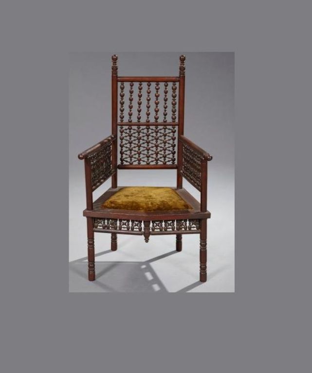 American Elizabethan Revival Walnut Occasional Chair, third quarter 19th century, the back with a grape- and leaf-carved crest supported by twist-turned stiles, with bowed seat and turned legs.