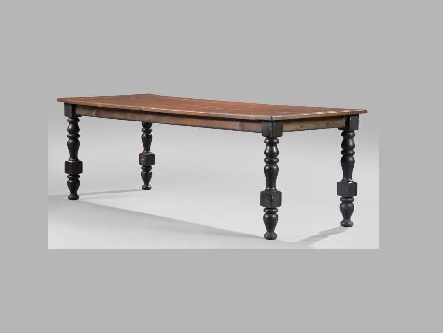 American rustic/country farmhouse dining table. The rectangular pine plank top with bread-board ends, raised on four large painted block-and-turned legs. 

Appealing form with good proportions - a sturdy piece that comfortably seats 8 people.