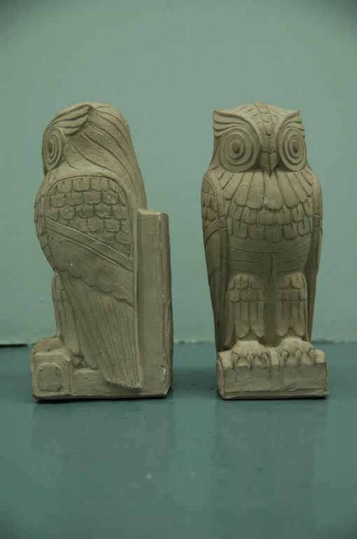 A whimsical pair of owl bookends, each plaster with impressed seal mark on the reverse reading Library of Congress. Weighty, as bookends should be.

These smaller versions based on the monumental pair of owls gracing the entry to the Library of