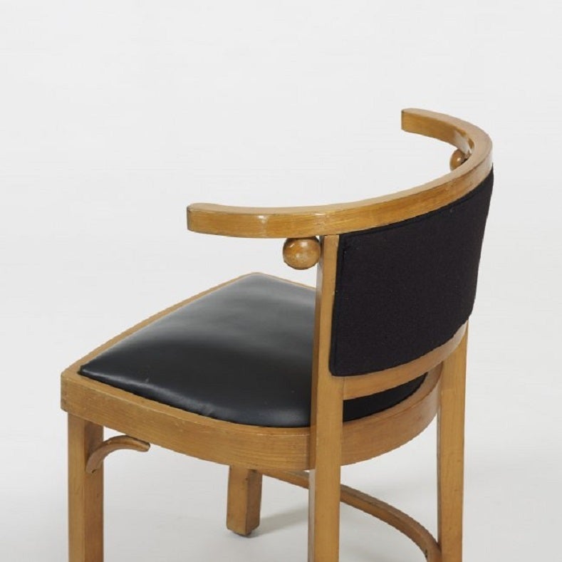 These are wood lacquered chairs in the style of the original circa 1905 designed by the architect and designer Josef Hoffmann (1870-1956). Hoffmann was influenced by the Arts and Crafts Movement and Charles Rennie Mackintosh. Concerned with