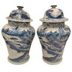 Pair of Blue and White Ceramic Lidded Vases