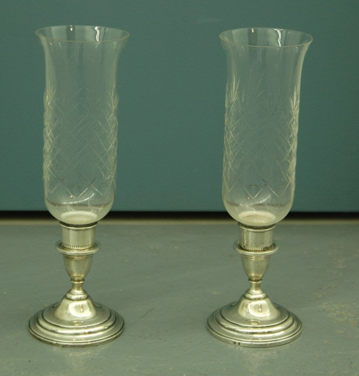 Pair of cut-glass and silverplate hurricane lamps by International Silver Co. in the Lord Saybrook pattern (introduced 1959)

Maker's mark on base of each lamp, reading 