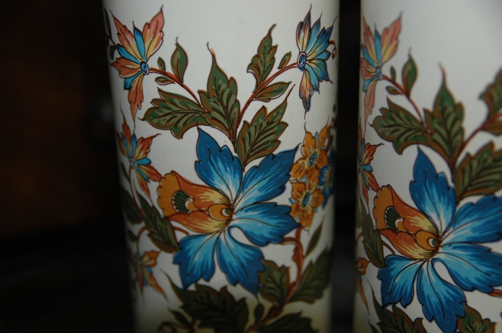 Pair of vibrant cylindrical pottery vases from the Netherlands. Marked but not yet identified in the manner of works by Gouda and their competitors.

Mark on both vases consists of an upside-down star with the script Monogram 