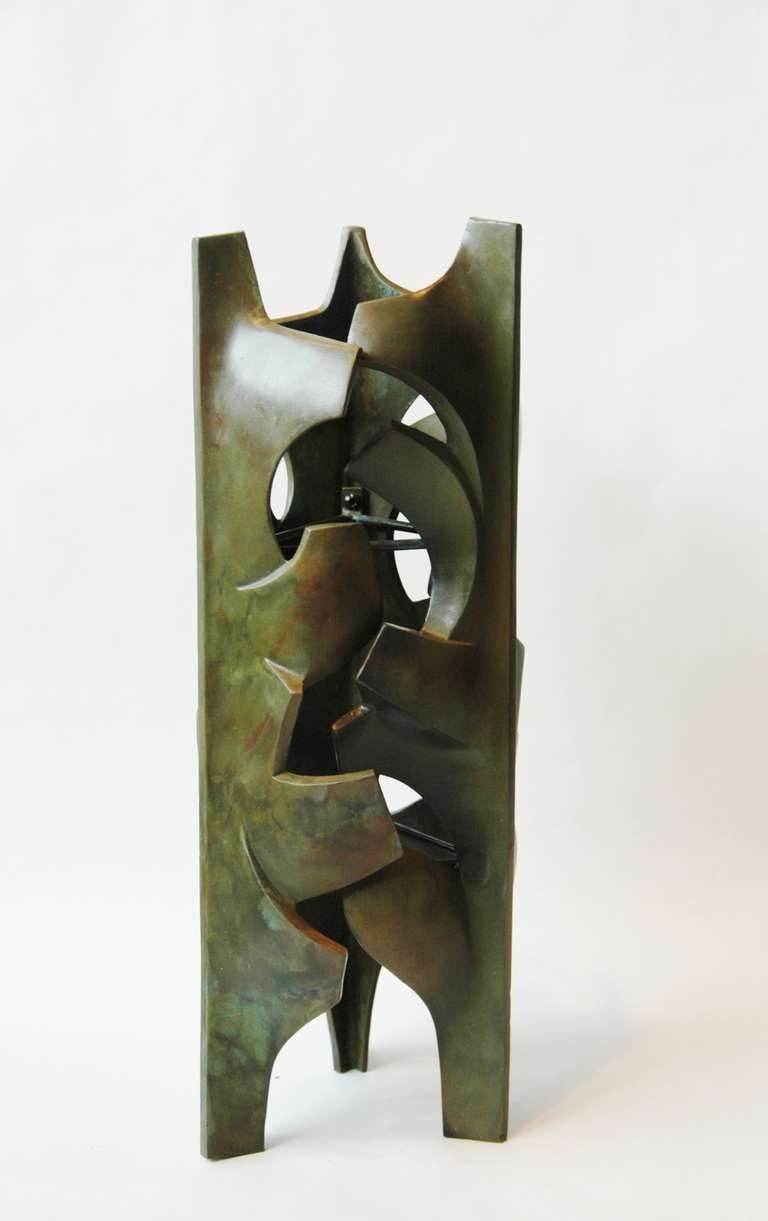 An impressive and heavy bronze sculpture possibly for use as a sconce, designed, circa 1962; example produced later by Malcolm Leland.

Malcolm Leland began his career as a potter and ceramicist, studying at the Jepson Art Institute. He won the