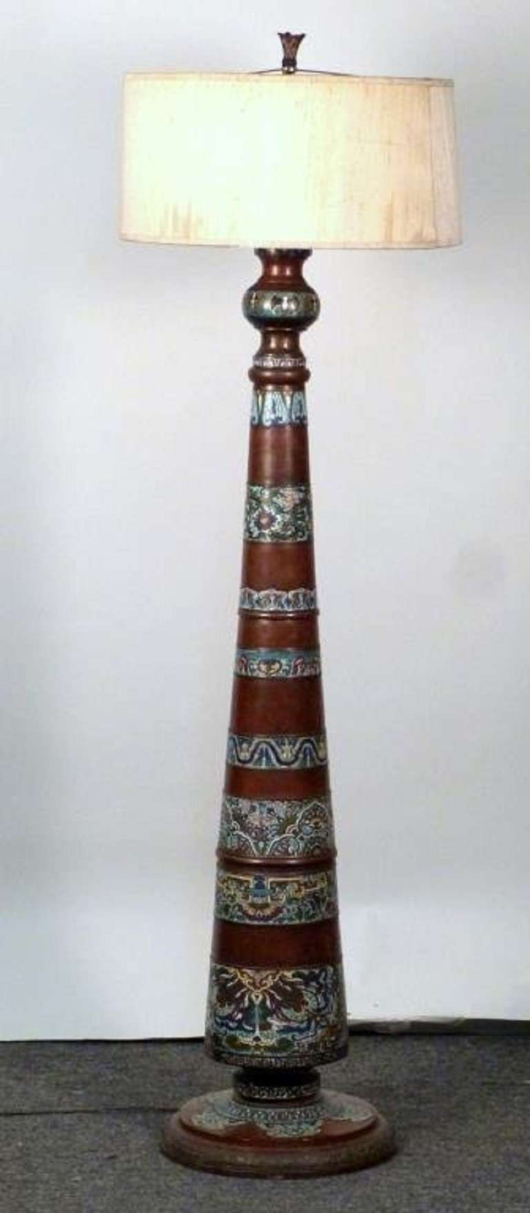 This Chinese Champleve floor lamp has beautiful bands of intricate cloisonné decoration and a conical, metal form.