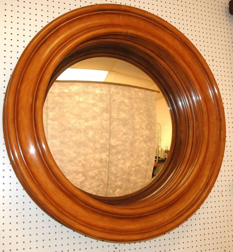A Large beautifully turned round convex mahogany mirror with a deep frame by Ralph Lauren with a label  on the reverse. 
No longer in production this model was one of the companies most loved classic pieces.
