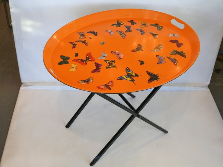 Stunning Foransetti tray with wood and leather stand. Vibrant orange color with beautiful multi-colored painted butterflies.  Gorgeous statement piece! 

Tray Dimensions: 27.5