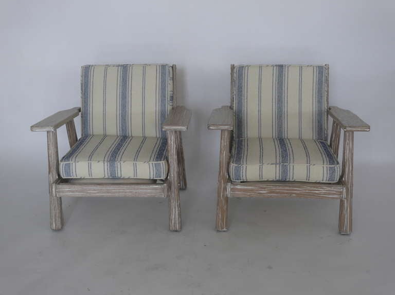 Wonderful pair of Brandt Ranch lounge chairs with newly cerused wood finish and blue striped upholstery. Low profile with wide arms and deep seat. Extremely comfortable!