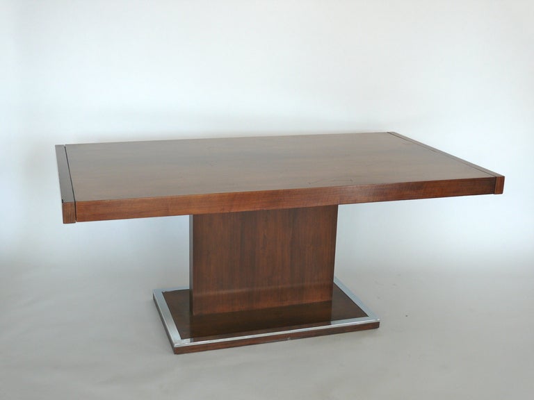 Gorgeous Milo Baughman walnut single pedestal table.  Table comes with 2 leaves and can be extended to 100