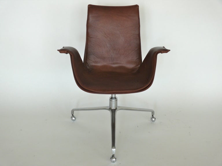 Original 3-legged version of the classic Preben Fabricius bird office chair. Sometimes also referred to as the tulip chair. Original leather on the base has been re-dyed to a gorgeous, rich brown color with new leather on the cover. HMachined chrome