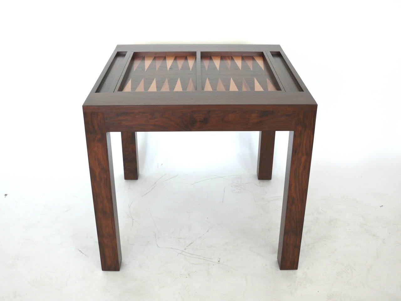 Parson's style backgammon table newly produced and refinished in a medium walnut. The game board features hand inlaid mahogany and beech wood. Playing surface flips to reveal a solid walnut tabletop perfect for board or card games. Custom finishes