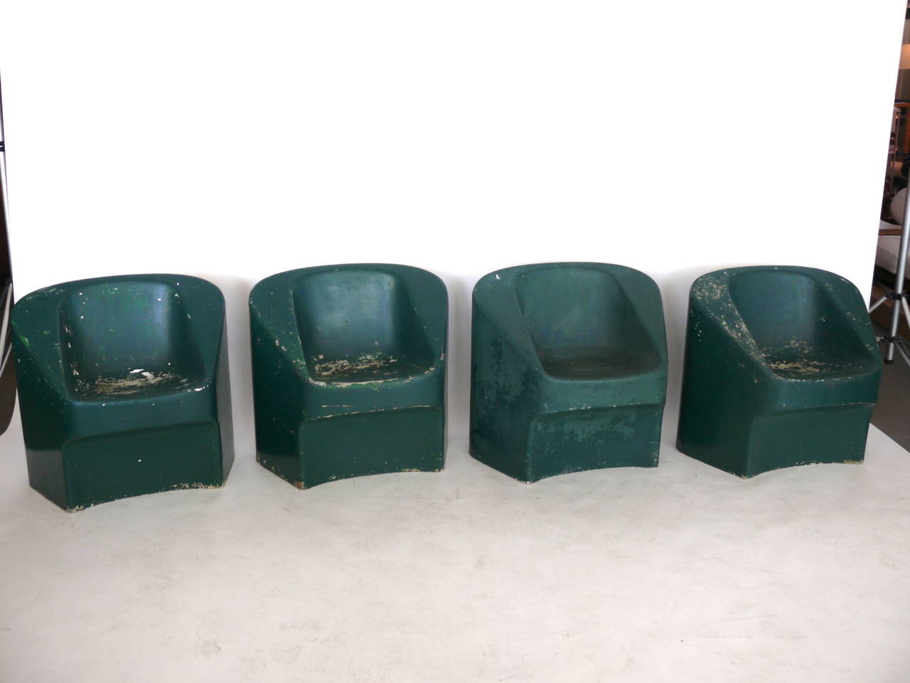 Fantastic set of four cement chairs by Swiss architect Willy Guhl. Chairs would look great inside or out. Each chair in its own state of vintage condition. Very comfortable. 4 chairs available. Priced as a pair.