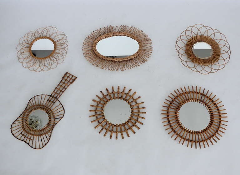 Incredible collection of vintage French sunburst mirrors made of bamboo and rattan. Varying shapes and designs. Beautiful hung together as a unique grouping. Two available. Priced individually. Top left : $395, top right : $395.