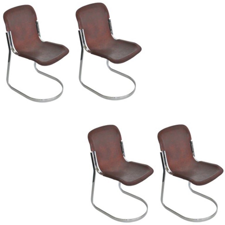 Beautiful set of four brown leather sling dining room chairs.  Chair rests on a sleek cantilevered chrome base. Great patina to the leather and extremely comfortable. Sold and priced as a set of four.