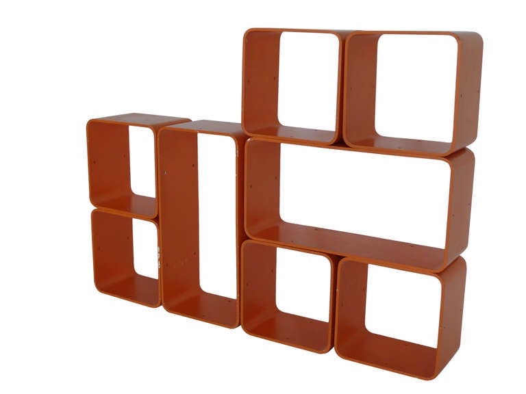 Fantastic collection of 8 orange modular wood bookshelf cubes in original condition and paint. Set includes 2 rectangular pieces and 6 square pieces. Cubes are extremely versatile as they allow you to create your own configuration. Cubes have holes